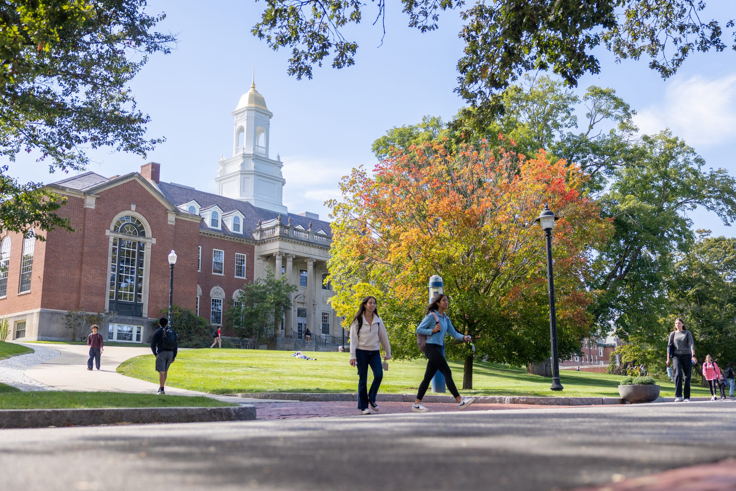 students walking in front of Wilbur Cross building