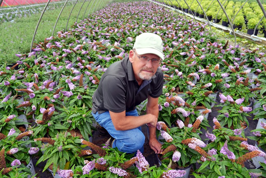 posing with flowers