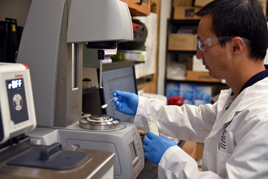 researcher taking a sample