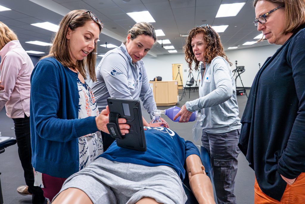 faculty working on a dummy