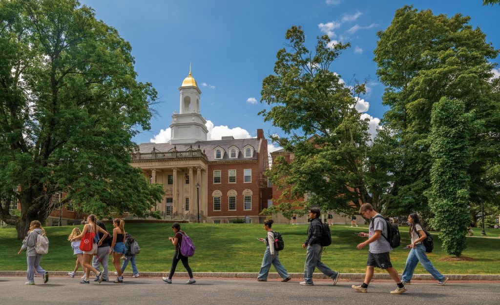 students walking in front of Wilbur Cross building