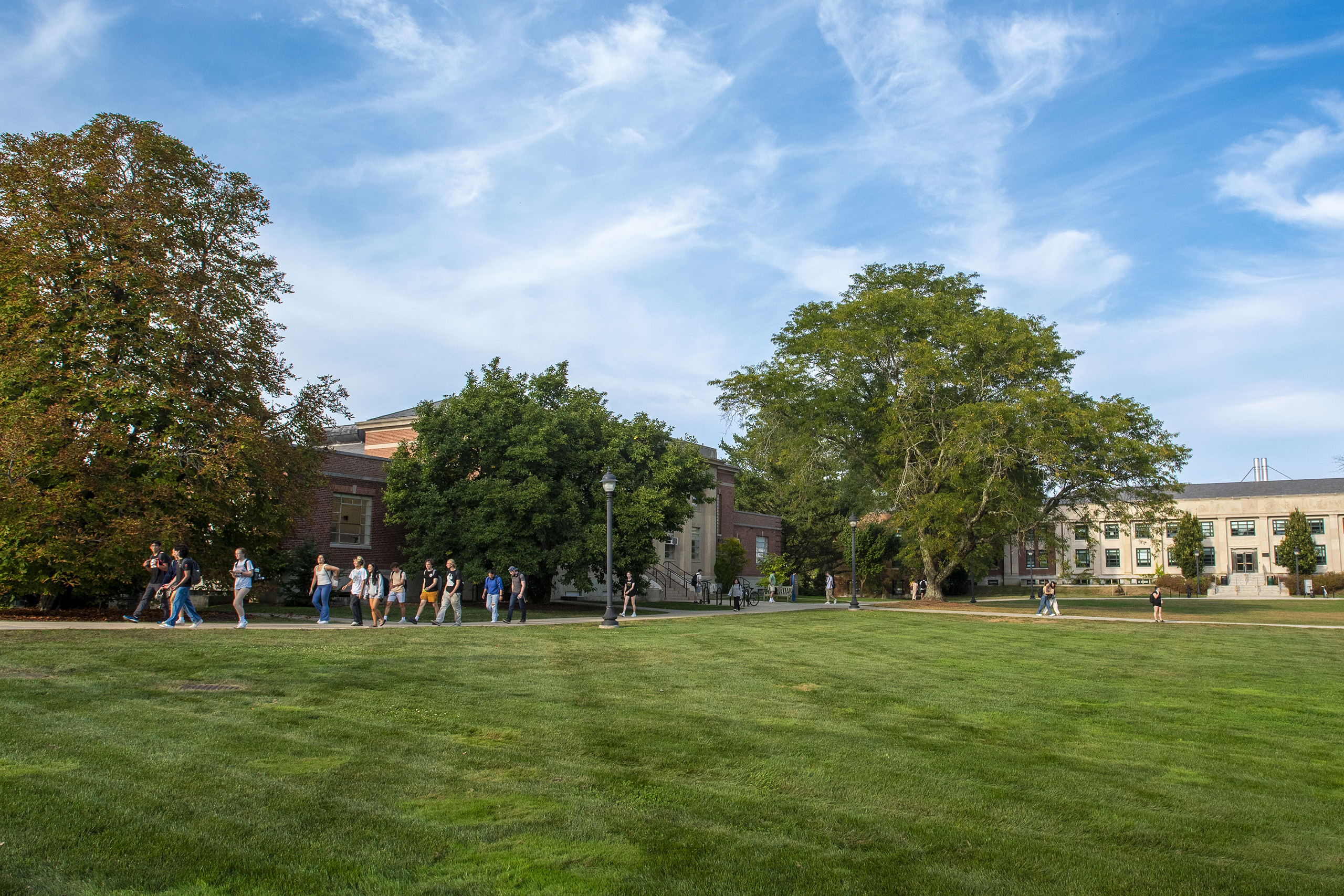 students walking on the Young building lawn